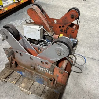 Used Bode welding rotator set, drive unit with motor and control box in front of idler