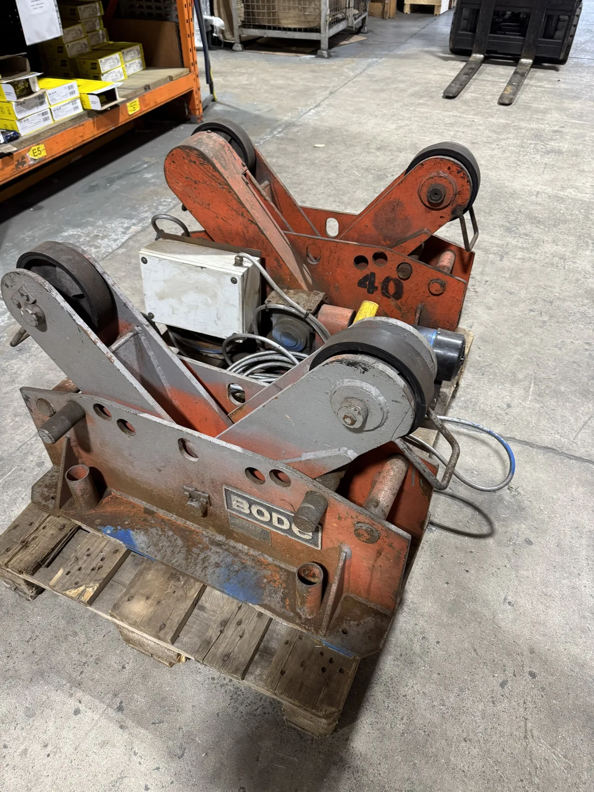 Used Bode welding rotator set, drive unit with motor and control box in front of idler