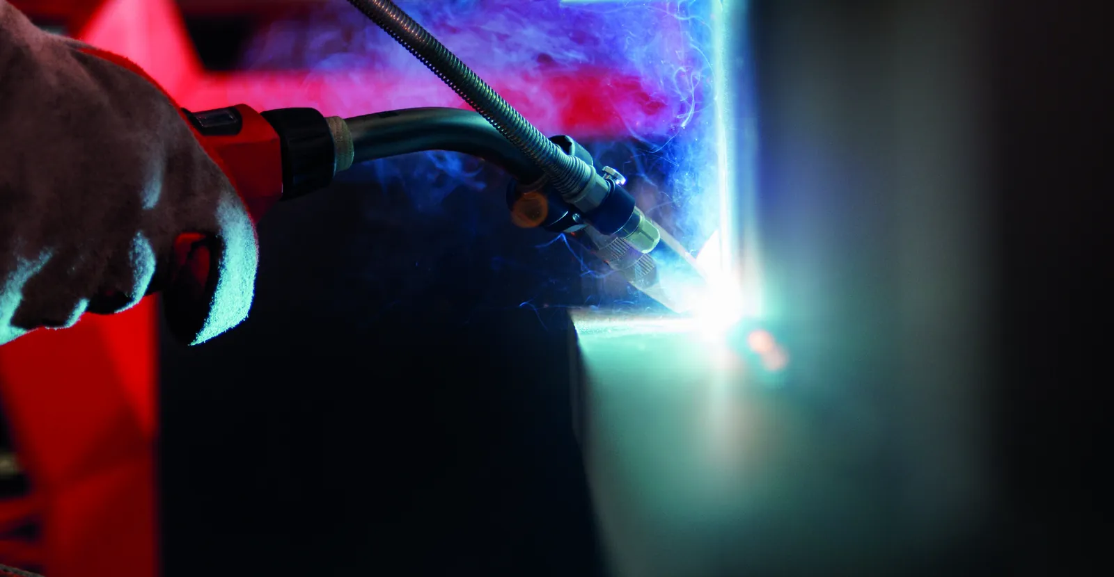 A welder simply holding the torch while Velo sets the travel speed