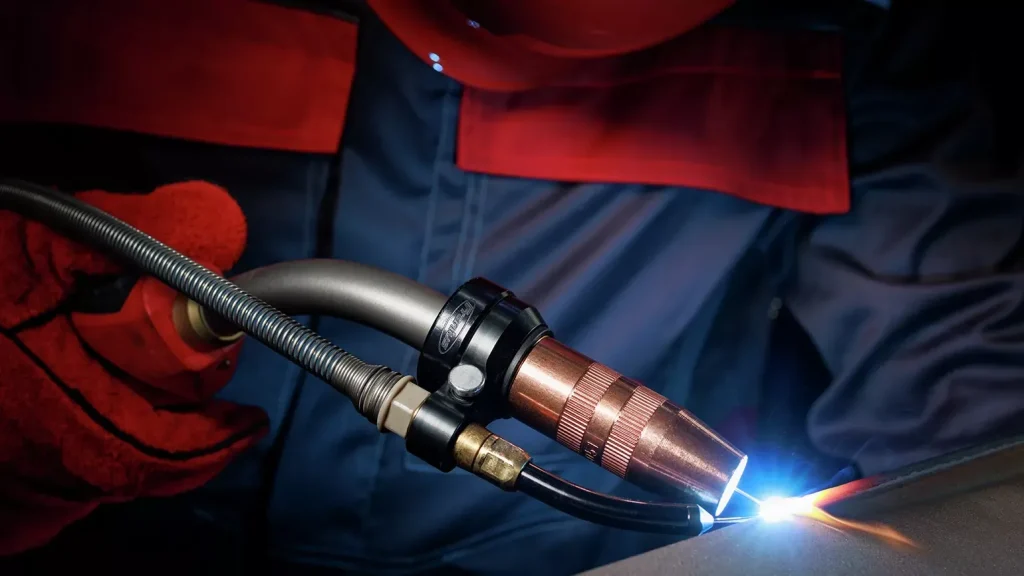 Close-up of the Velo wire guiding a MIG torch along the seam